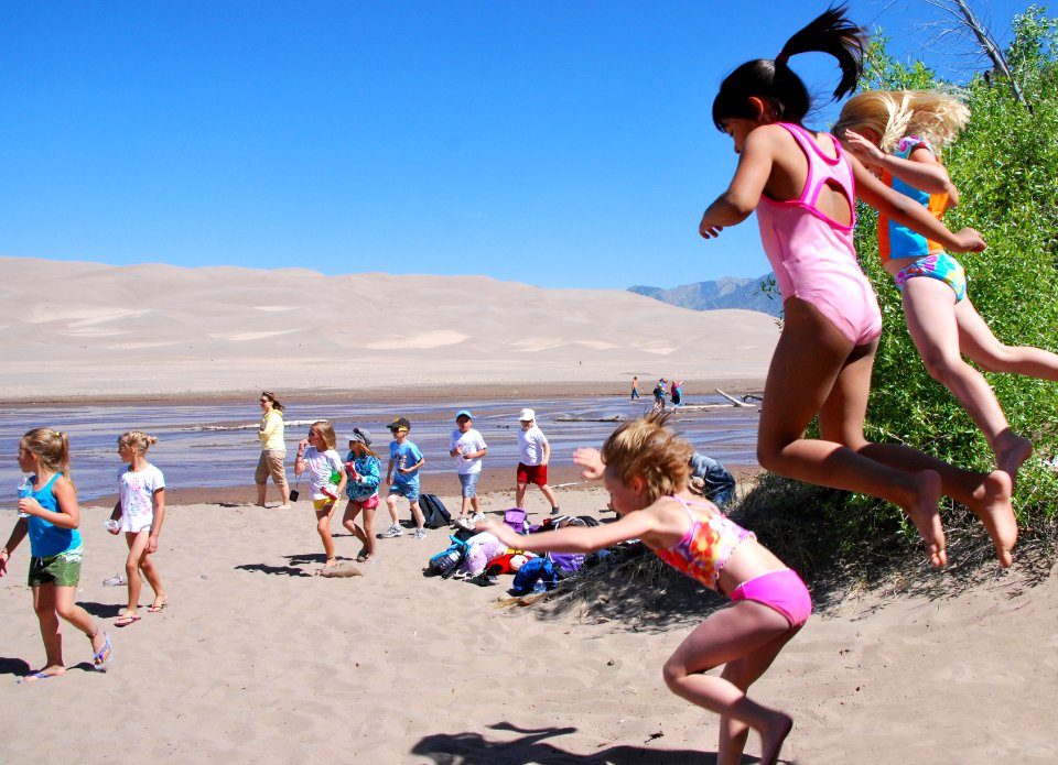 Girls Jumping Near Medano Creek