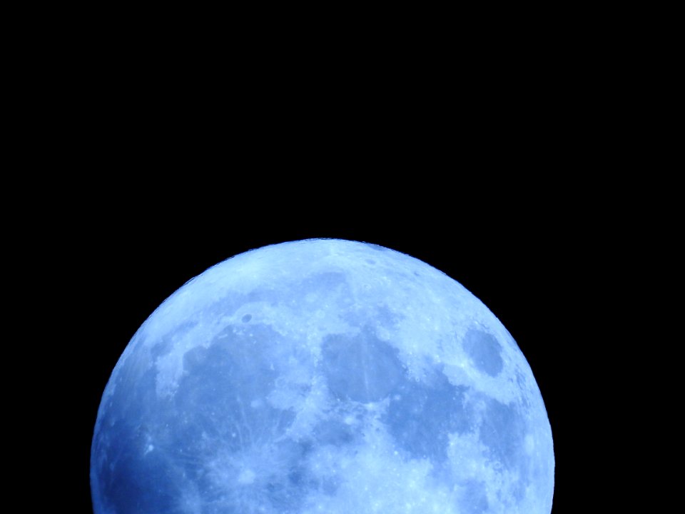 Blue moon, green moon, yellow moon. Tonight's full moon in Fort Collins, Colorado