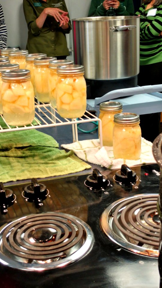 Canned pears next to stove