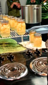 Canned pears next to stove
