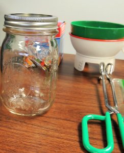 Canning jar, funnels, and jar lifter photo