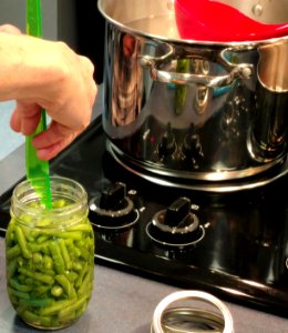 Measuring headspace for canned green beans photo