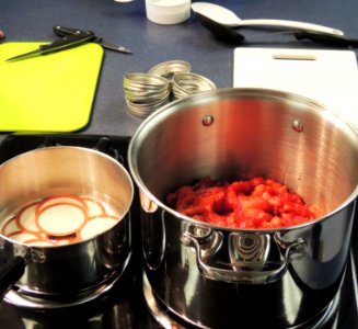 Cooking strawberries for jam photo