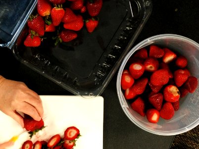 Preparing strawberries for jam photo