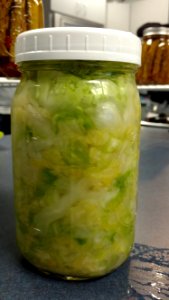 Mason jar filled with sauerkraut photo