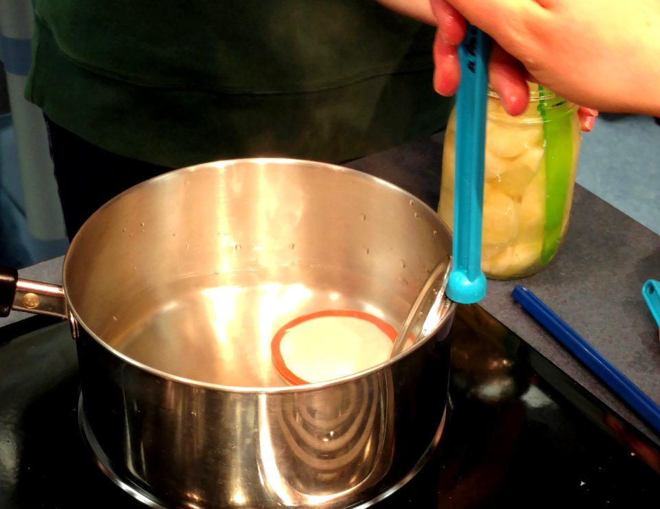 Placing lids on canning jar