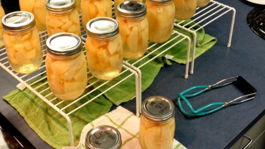 Canned pears and jar lifter photo