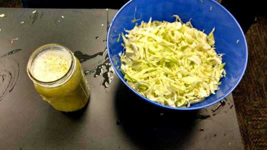Shredded cabbage and filled mason jar photo