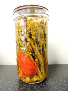 Pickled asparagus in mason jar