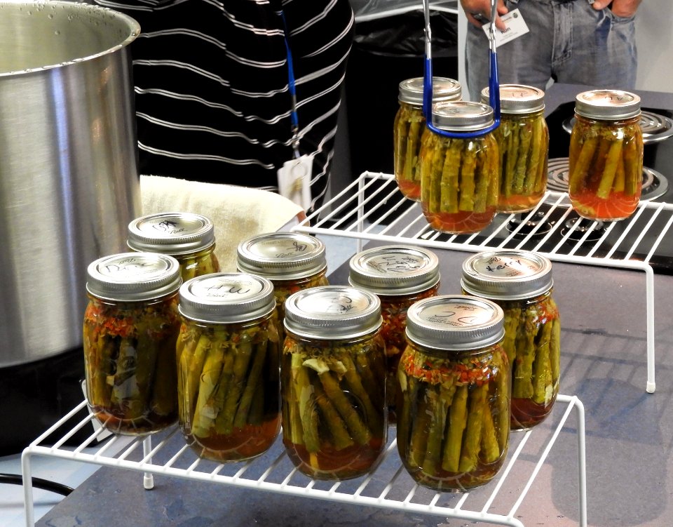 Removing processed pickled asparagus from the canner
