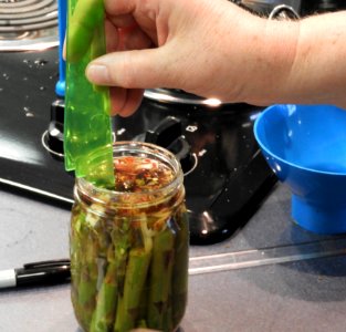Measuring headspace for pickled asparagus photo