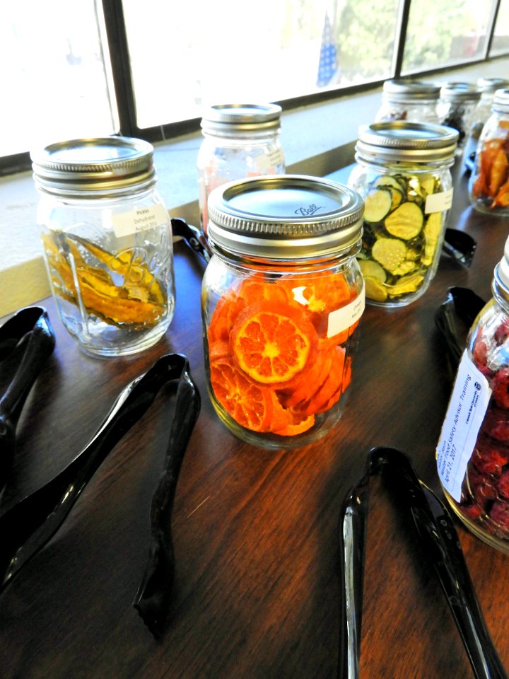 Dried fruits and vegetables with tongs