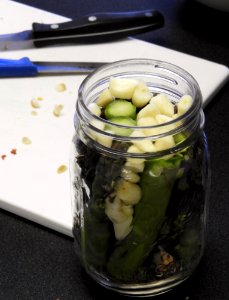 Pickled asparagus ready for brine to be added photo