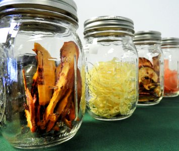 Dried apples and onions in mason jars photo