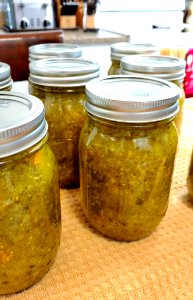 Jars of pickle relish cooling following boiling water bath canner processing photo