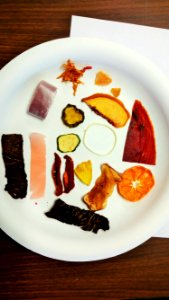 Dried fruits and vegetables on a plate photo