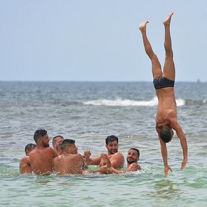 Swimming trunks somersault submerge photo