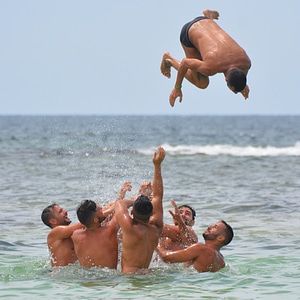 Swimming trunks somersault submerge photo