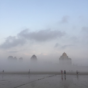 Fog early in the morning tall buildings photo