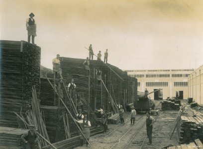 Workers with the wood supplies for buildings the New Zealand South Seas Exhibition 1924