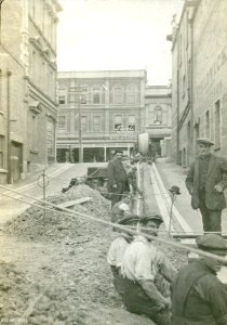 Laying electrical cable in Bath Street looking towards Stuart Street c1920s