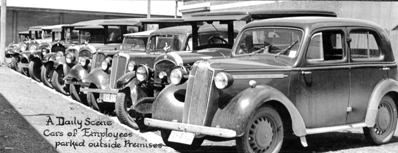 "A Daily Scene, Cars of Employees parked outside Premises" 1938