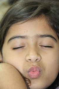 Kiss pout child photo
