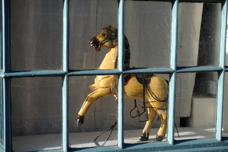 3 Legged Wooden Horse in a Window in Warwick