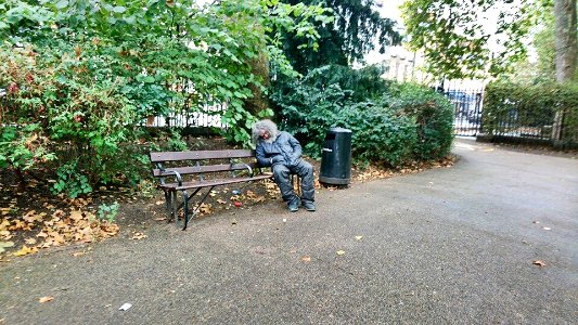 Tramp on a park bench.