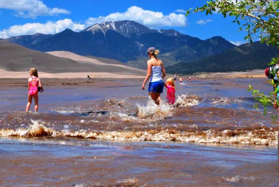 Mother and Daughters in Medano Creek, Surge Flow