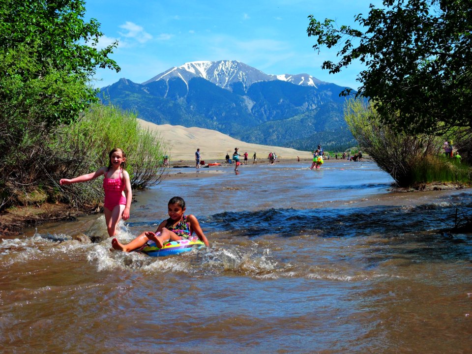 Girls Floating and Splashing in Medano Creek