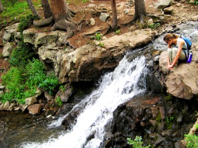 Woman Beside Waterfall, Sand Creek Basin, Great Sand Dunes National Preserve