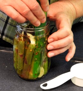 Removing air bubbles from pickled asparagus photo