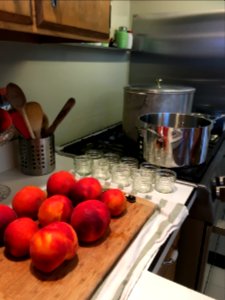 Peaches with jam jars and boiling water bath canner photo