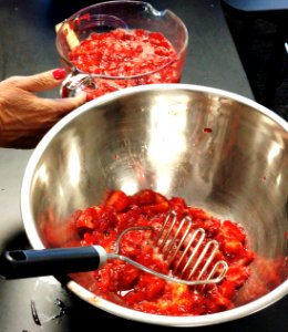 Mashing strawberries for jam