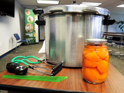 Canned peaches and supplies photo