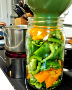Heating vinegar solution for pickled peppers photo
