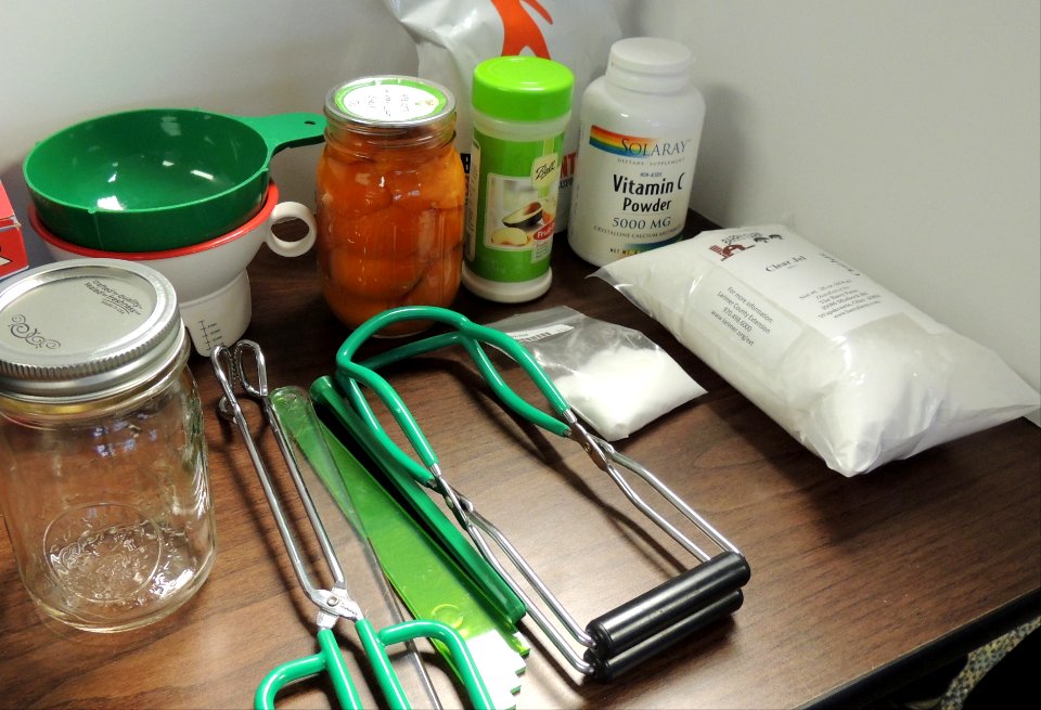 Home canning supplies on table photo