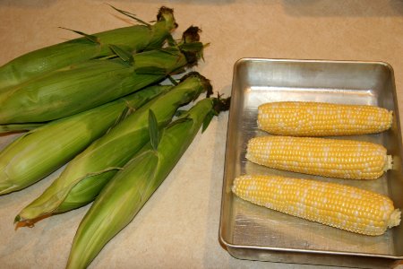 Ears of corn with and without husk photo