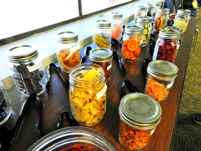 Jars of dried fruits and vegetables photo