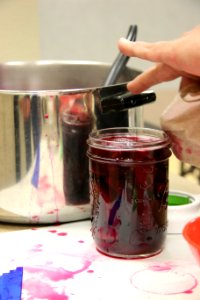 Cleaning rim before placing lid and ring on jar