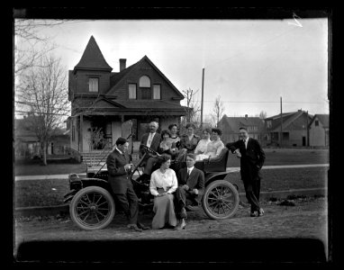 Family posing with car c1913 photo
