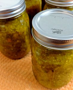 Home-canned pickle relish in mason jars photo