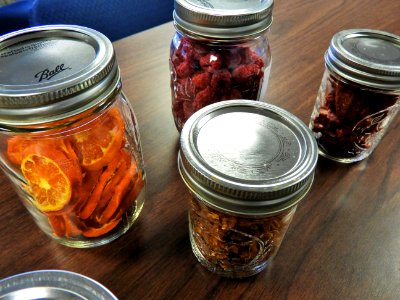 Dehydrated foods in mason jars on a table photo