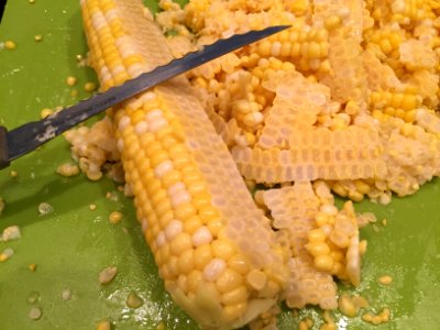 Knife used to remove kernels from cob photo