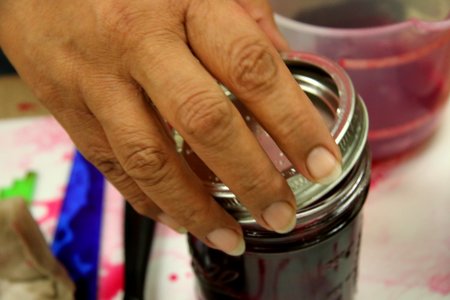 Adding lid and ring to pickled beet jar