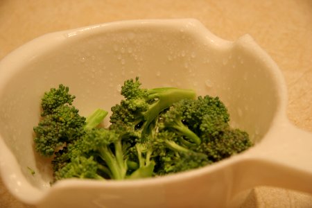 Cut and rinsed broccoli ready for blanching photo