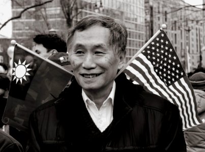 Man with flags sticking out of neck