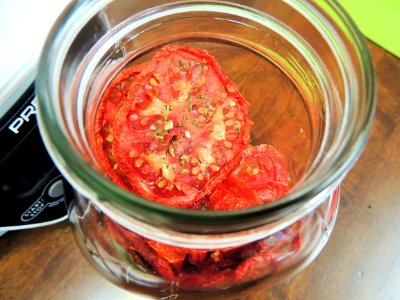 Dried tomatoes need to be conditioned to evenly distribute any residual moisture photo