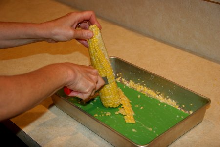 Corn being cut from cob 2 photo